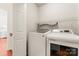 Convenient laundry room features washer and dryer units with shelving at 1226 Flint Ct, Matthews, NC 28104
