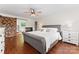 Spacious main bedroom featuring a fireplace, soaking tub, and stylish barn door entry at 1226 Flint Ct, Matthews, NC 28104