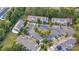 Aerial view of townhomes with parking and trees in a neighborhood at 12928 Sickles Dr, Charlotte, NC 28273