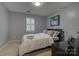 Bedroom featuring neutral walls, carpeted floors, and a window with shutters at 12928 Sickles Dr, Charlotte, NC 28273