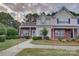 Charming townhouse featuring a well-kept lawn, brick accents, and inviting curb appeal at 12928 Sickles Dr, Charlotte, NC 28273