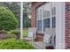 Cozy front porch featuring comfortable seating and vibrant landscaping, perfect for enjoying the outdoors at 12928 Sickles Dr, Charlotte, NC 28273