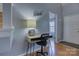 Hallway with wood flooring, and a modern desk underneath a decorative 'blessed' sign at 12928 Sickles Dr, Charlotte, NC 28273