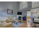 Bright living room featuring a fireplace, hardwood floors, and a staircase to the second floor at 12928 Sickles Dr, Charlotte, NC 28273