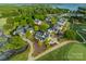 An aerial view shows the beautiful homes surrounded by lush landscaping and mature trees at 142 Tuscany Trl, Mooresville, NC 28117