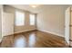 Bright bedroom with hardwood floors, natural light, and neutral paint scheme at 142 Tuscany Trl, Mooresville, NC 28117