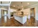 Large kitchen features white cabinetry, granite countertops, stainless steel appliances and an island at 142 Tuscany Trl, Mooresville, NC 28117