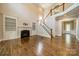 Spacious living room with fireplace and stairs to the second floor at 142 Tuscany Trl, Mooresville, NC 28117