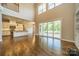 View of the open-concept floor plan and large sliding doors leading to a covered patio at 142 Tuscany Trl, Mooresville, NC 28117