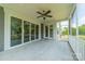 Relaxing screened porch with ceiling fan, offering an inviting space for outdoor enjoyment at 142 Tuscany Trl, Mooresville, NC 28117