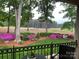 Scenic backyard view showcasing lush greenery, flowering shrubs, and golf course at 17048 Jetton Rd, Cornelius, NC 28031