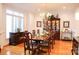 Formal dining room with hardwood floors, large windows and a chandelier at 17048 Jetton Rd, Cornelius, NC 28031