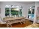 Dining room with hardwood floors, a rustic table, bench, and a view of the pool at 17048 Jetton Rd, Cornelius, NC 28031