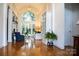 Bright living room with vaulted ceiling, fireplace, a large window and glass doors to the backyard at 17048 Jetton Rd, Cornelius, NC 28031