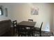 Cozy dining area with a dark wood table and chairs, adjacent to the living room at 1707 Van Dyke Dr, Charlotte, NC 28213