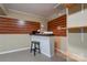 Finished basement area with a bar, shelving, and decorative wood panels at 1925 S Lafayette St, Shelby, NC 28152