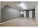 Brightly lit basement with neutral walls, flooring and white double door closets at 1925 S Lafayette St, Shelby, NC 28152