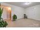 Basement features neutral walls, a sitting chair, and door access to other spaces at 1925 S Lafayette St, Shelby, NC 28152