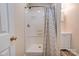 Bathroom features a shower, neutral walls, and door to enter space at 1925 S Lafayette St, Shelby, NC 28152