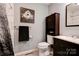 Modern bathroom with stylish decor, a dark vanity, and a tiled shower at 1925 S Lafayette St, Shelby, NC 28152