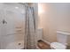 Neutral bathroom features a shower, cabinet, sink, and toilet at 1925 S Lafayette St, Shelby, NC 28152