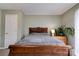 Bedroom featuring natural lighting, a cozy bed, and calming green wall colors at 1925 S Lafayette St, Shelby, NC 28152