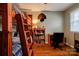 Bright bedroom featuring bunk beds, wood-look flooring, and a convenient study area at 1925 S Lafayette St, Shelby, NC 28152