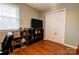 Bedroom featuring wood-look floors, a closet, and shelving with accent lighting at 1925 S Lafayette St, Shelby, NC 28152