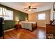 Spacious bedroom with wood-look floors and a ceiling fan at 1925 S Lafayette St, Shelby, NC 28152