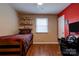 Bedroom showcasing wood-look flooring, natural light, and shelving at 1925 S Lafayette St, Shelby, NC 28152