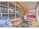 Cozy front porch with rocking chairs and a porch swing, perfect for enjoying the outdoors at 1925 S Lafayette St, Shelby, NC 28152