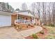 Inviting brick home with a charming, covered front porch featuring white railings and a walkway at 1925 S Lafayette St, Shelby, NC 28152