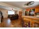 Open kitchen with breakfast bar that flows seamlessly into the adjacent living room at 1925 S Lafayette St, Shelby, NC 28152