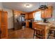 Functional kitchen with stainless steel appliances, ample cabinetry, and a breakfast bar at 1925 S Lafayette St, Shelby, NC 28152