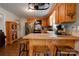 Well-equipped kitchen with wooden cabinets, stainless steel appliances, and tiled countertops at 1925 S Lafayette St, Shelby, NC 28152