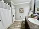 Bathroom with shower, commode and vanity with granite countertops and dark wood cabinetry at 1937 Hickory Dr, Lancaster, SC 29720