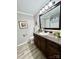 Bathroom vanity with granite countertops, dark wood cabinetry, and modern fixtures at 1937 Hickory Dr, Lancaster, SC 29720