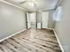 Bedroom with neutral colored walls, laminate floors, two white closet doors and a ceiling fan at 1937 Hickory Dr, Lancaster, SC 29720