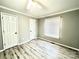 Bedroom with ceiling fan, closet, laminate floor, neutral paint and good natural light at 1937 Hickory Dr, Lancaster, SC 29720