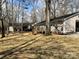 Backyard with deck, mature trees and grass at 1937 Hickory Dr, Lancaster, SC 29720