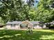 Charming ranch home with a well-manicured lawn and a welcoming front porch, perfect for enjoying the outdoors at 1937 Hickory Dr, Lancaster, SC 29720