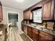 Cozy kitchen featuring wood cabinets, stainless steel appliances, and a view from the window at 1937 Hickory Dr, Lancaster, SC 29720