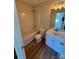 Bathroom with a tub-shower combo, toilet, and vanity with modern fixtures at 1941 Olsen Ln, Charlotte, NC 28213