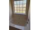 Bathroom featuring a bathtub with a large window, providing natural light at 1941 Olsen Ln, Charlotte, NC 28213