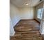 Inviting bedroom with natural light, showcasing luxury vinyl flooring and neutral color palette at 1941 Olsen Ln, Charlotte, NC 28213