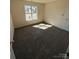 Comfortable bedroom with gray carpet and natural light streaming through the window at 1941 Olsen Ln, Charlotte, NC 28213