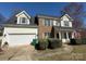 Well-maintained two-story home featuring a spacious two-car garage and a neatly landscaped front yard at 1941 Olsen Ln, Charlotte, NC 28213