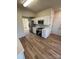 Contemporary kitchen featuring modern appliances, white cabinetry and vinyl flooring at 1941 Olsen Ln, Charlotte, NC 28213