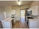 Well-equipped kitchen boasting stainless steel appliances, white cabinets, and pristine countertops at 1941 Olsen Ln, Charlotte, NC 28213