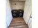 Laundry closet featuring a side-by-side washer and dryer with white folding doors at 1941 Olsen Ln, Charlotte, NC 28213